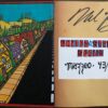 A book with a drawing of a street and buildings.