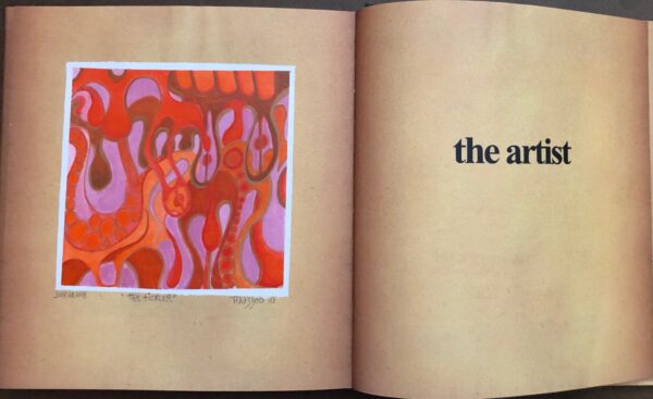 A book with an image of the artist 's work in it.