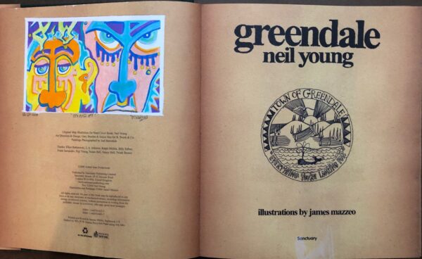 A book opened to the title page of neil young 's greendale.