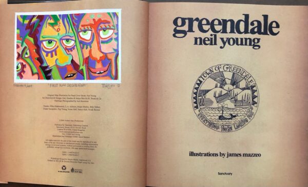 A book opened to the title page and an illustration of two faces.