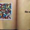 A book with an abstract picture on the page.