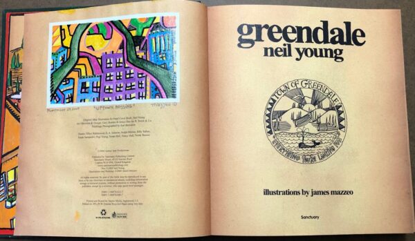 A book opened to the title page of neil young 's " greendale ".